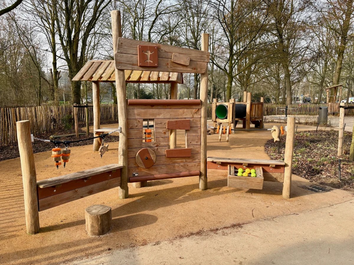 Wooden play structure for younger kids with creative puzzles and whimsical design
