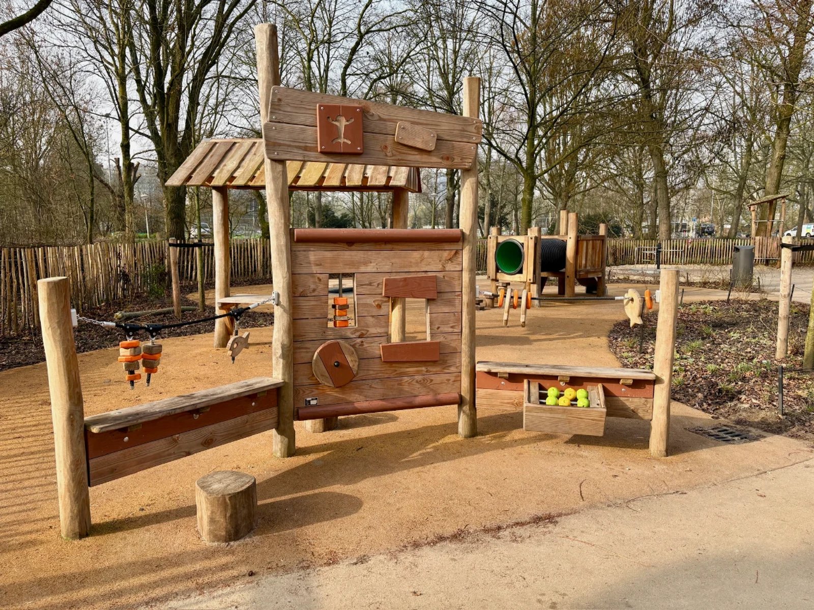 Wooden play structure for younger kids with creative puzzles and whimsical design