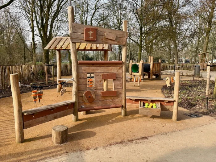 Wooden play structure for younger kids with creative puzzles and whimsical design