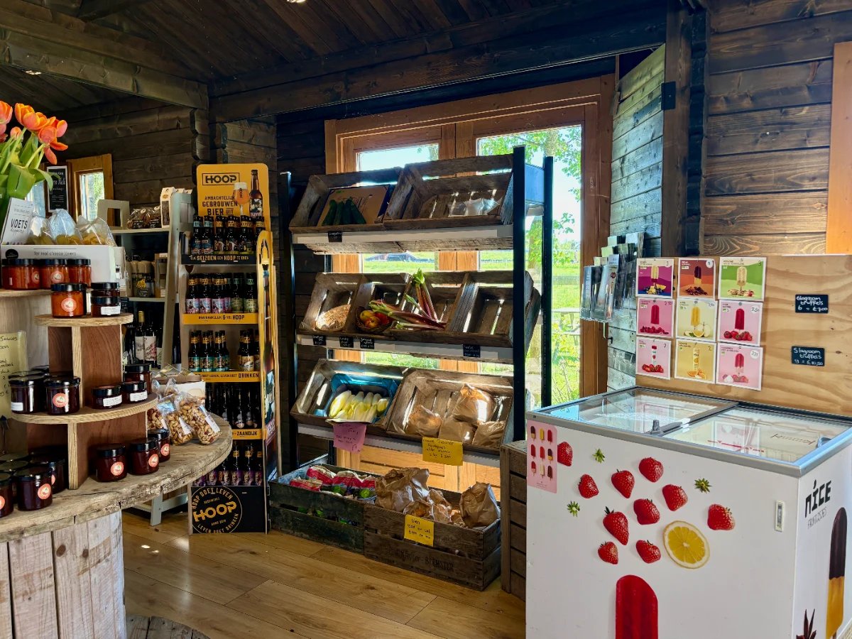 Farmers grocery with products on display and ice cream freezer