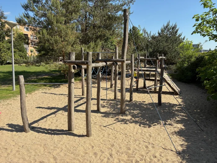 Wooden climbing structure on sand on sunny day