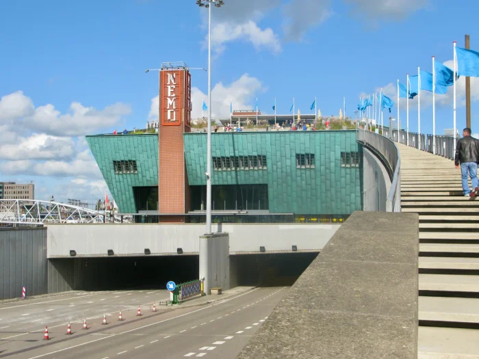 Staircase leading to roof terrace of NEMO Museum with roads passing underneath the green building