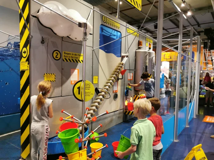 Kids playing with an interactive exhibit at a children's science museum 
