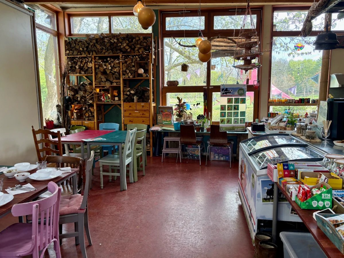 Community center cafe interior with eclectic furniture and decorations and counter with ice cream freezer